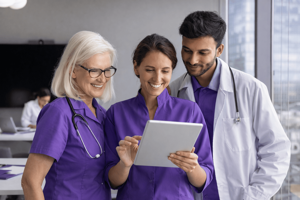 Dental virtual receptionist working at a computer with patient records